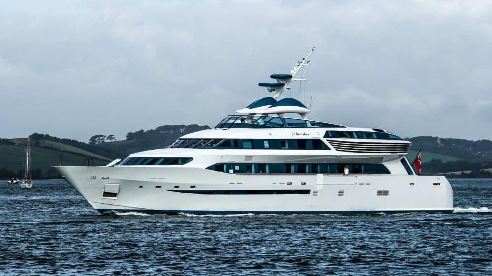 Alamshar motor yacht cruising on water, showcasing modern design and luxury features, highlighting its top speed of 60 knots and 50-meter length, relevant to fast super yachts in 2020.