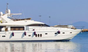 Luxury yacht docked in a marina, showcasing sleek design and marine environment, relevant to yacht electronics and marina maintenance discussions.