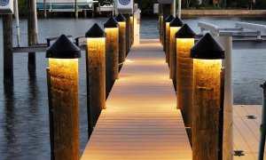 Dock with illuminated posts showcasing effective lighting solutions for marinas and private slips, enhancing safety and visibility.