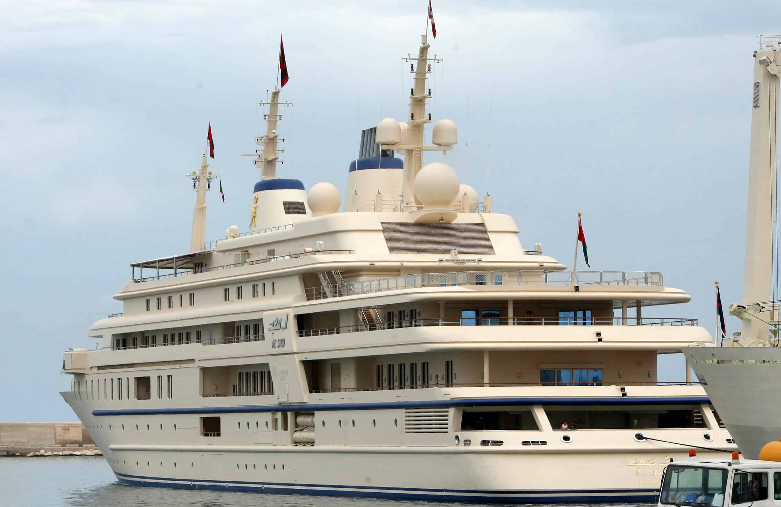 Luxury super yacht Al Said docked in harbor, showcasing elegant exterior design and multiple decks, associated with the Sultan of Oman, featured in context of the world's most expensive yachts.