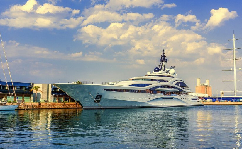 Luxury yacht docked at marina reflecting summer boating opportunities and enhancements for performance and comfort.