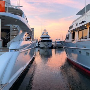 Luxury yachts docked in marina at sunset, showcasing marine engineering and yacht services in Fort Lauderdale.