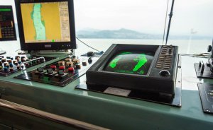 Marine navigation equipment displaying radar and chart data, essential for yacht and vessel operations, emphasizing the importance of electrical systems in marine engineering.