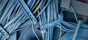 Marine electrical cables and wiring organized on a yacht, highlighting the importance of maintaining electrical systems in marine environments.