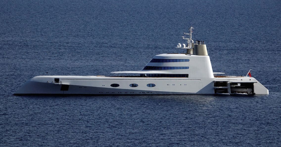 Motor Yacht A, a unique mega-yacht designed by Philippe Starck, showcasing its sleek, fish-like design in the ocean, highlighting luxury and innovation in yacht engineering.