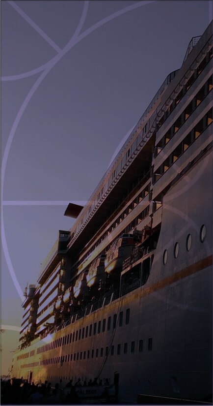 Large cruise ship docked at sunset, showcasing marine electrical systems and infrastructure, relevant to Tess Electrical LLC's services in the marine industry.