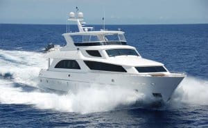Luxury yacht cruising through ocean waves, emphasizing marine electrical systems and safety in boating.