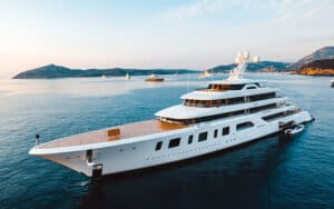 Luxury yacht navigating calm waters, showcasing advanced marine design and elegance, relevant to Tess LLC's yacht services and marine electrical systems expertise.
