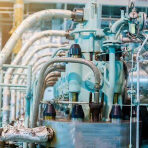 Marine electrical systems featuring complex machinery and piping, illustrating expertise in yacht electrical services and maintenance at Tess LLC.