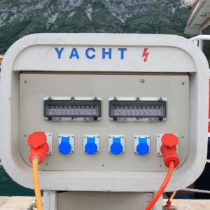Yacht shore power converter with blue and red connectors, showcasing electrical supply for yachts, emphasizing reliability and eco-friendliness in marine environments.