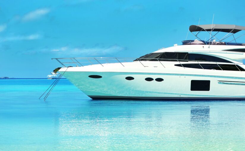 Luxury yacht anchored in clear blue waters, emphasizing marine security and investment protection for yacht owners.