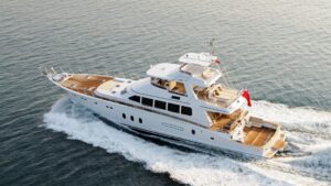 Luxury yacht cruising on calm waters, showcasing marine engineering and maintenance importance for yacht owners.