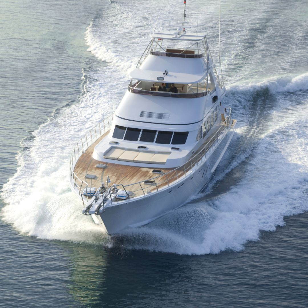 Luxury yacht navigating through calm waters, showcasing professional marine repair and maintenance services by Tess LLC for reliable yacht electrical systems.