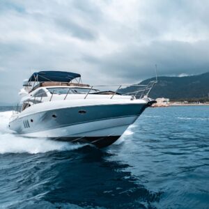 Yacht cruising on water, emphasizing the importance of yacht security systems for protection against theft.