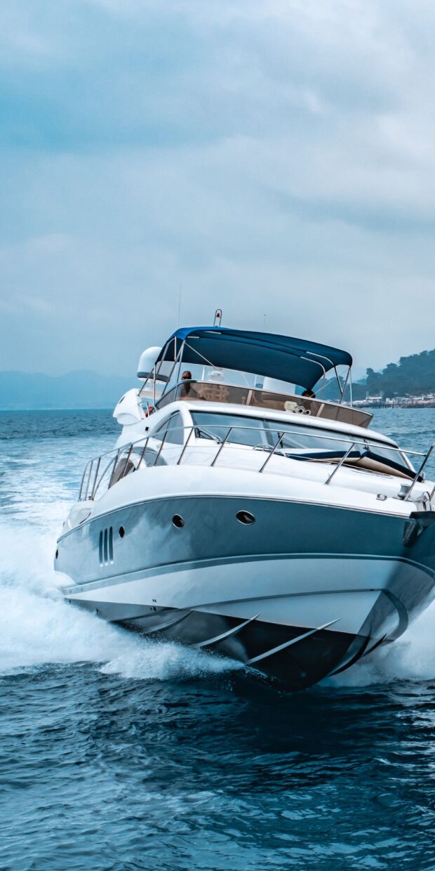 Yacht cruising on water, showcasing marine electrical services by Tess LLC, emphasizing reliability and performance in Fort Lauderdale.
