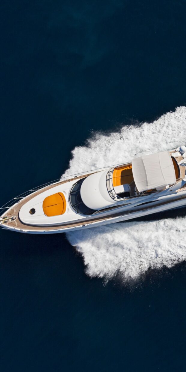 Yacht cruising on deep blue waters, showcasing advanced marine electrical systems and design, relevant to yacht services in Broward County.