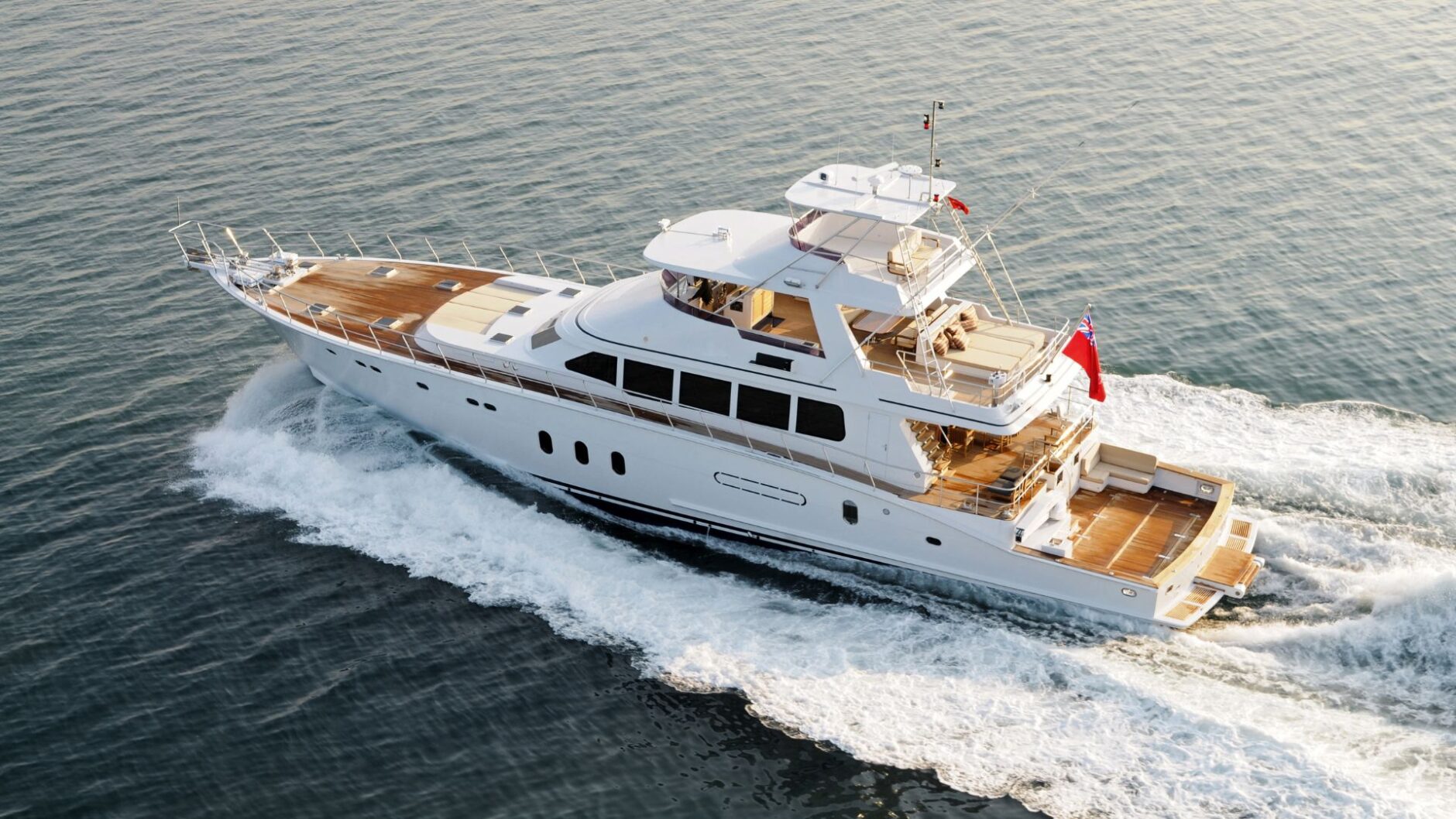 Luxury yacht cruising on calm waters, showcasing marine electrical systems and design, representing Tess LLC's yacht electrical services in Fort Lauderdale.