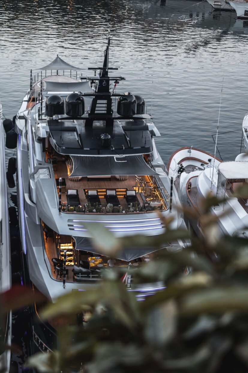 Luxury yacht docked at Safe Harbor Savannah Yacht Center, featuring an expansive deck with seating, sophisticated lighting, and modern design elements, emphasizing TESS LLC's yacht maintenance and electrical services.