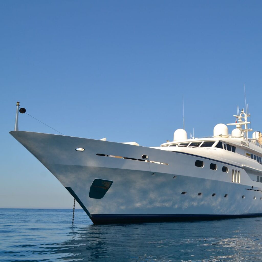 Luxury yacht on calm waters, showcasing advanced design and security features relevant to yacht alarm systems.