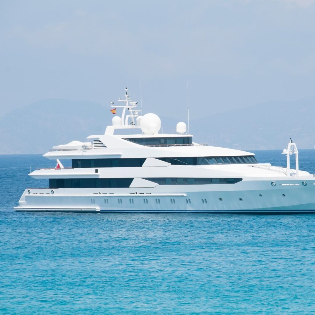 Luxury yacht cruising in blue waters, showcasing modern design and technology, relevant to upcoming boat shows and marine trends.