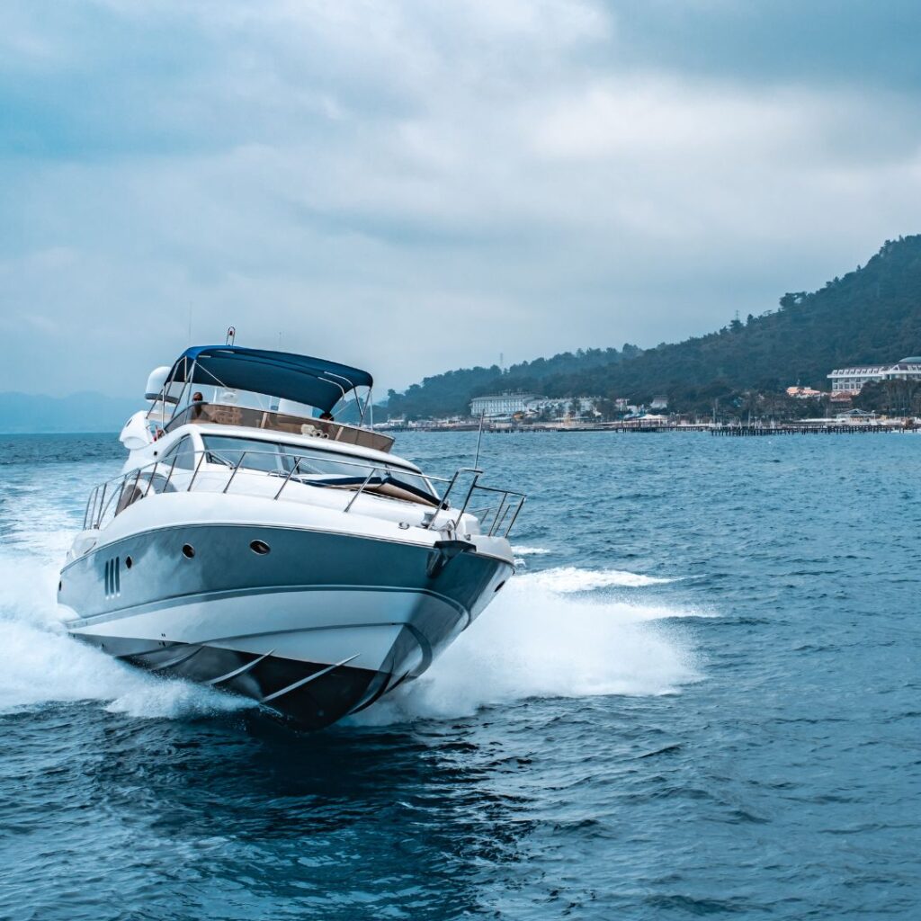 Luxury motorboat cruising on water, showcasing sleek design and marine engineering, relevant to upcoming boat shows in Florida.