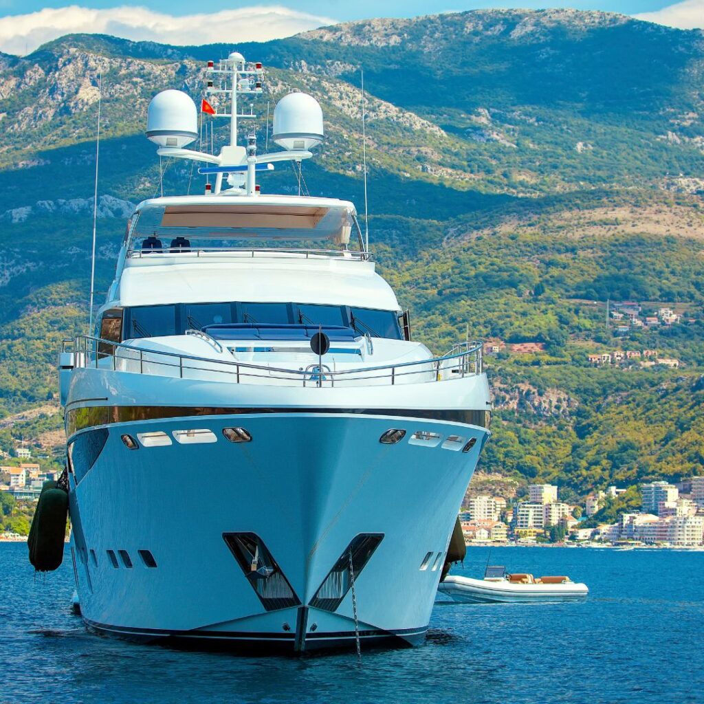 Luxury yacht anchored in scenic bay, showcasing sleek design and modern features, relevant to Tampa Bay Boat Show and marine industry.