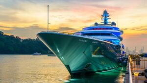 Luxury yacht docked at sunset, highlighting marine electrical services and yacht maintenance.