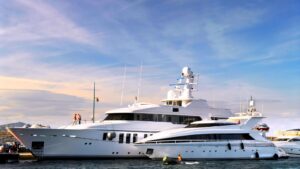 Luxury yacht docked in marina, showcasing marine engineering and electrical services relevant to yacht maintenance and power management by Tess Electrical LLC.