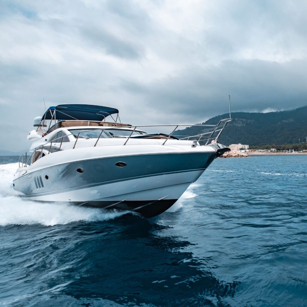 Luxury motor yacht cruising on calm waters, emphasizing the importance of marine maintenance and repair services.