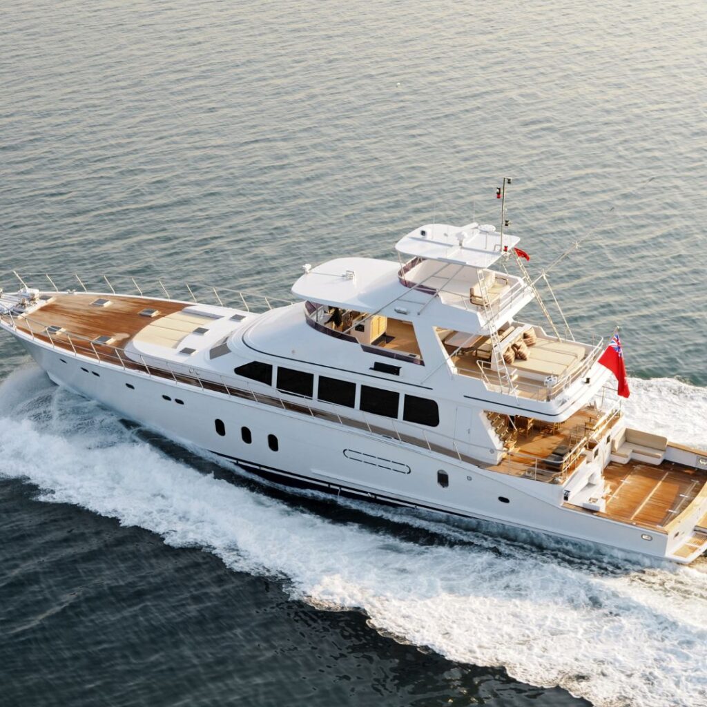 Luxury yacht navigating through calm waters, showcasing advanced marine power management features, relevant to Tess LLC's marine electrical services.