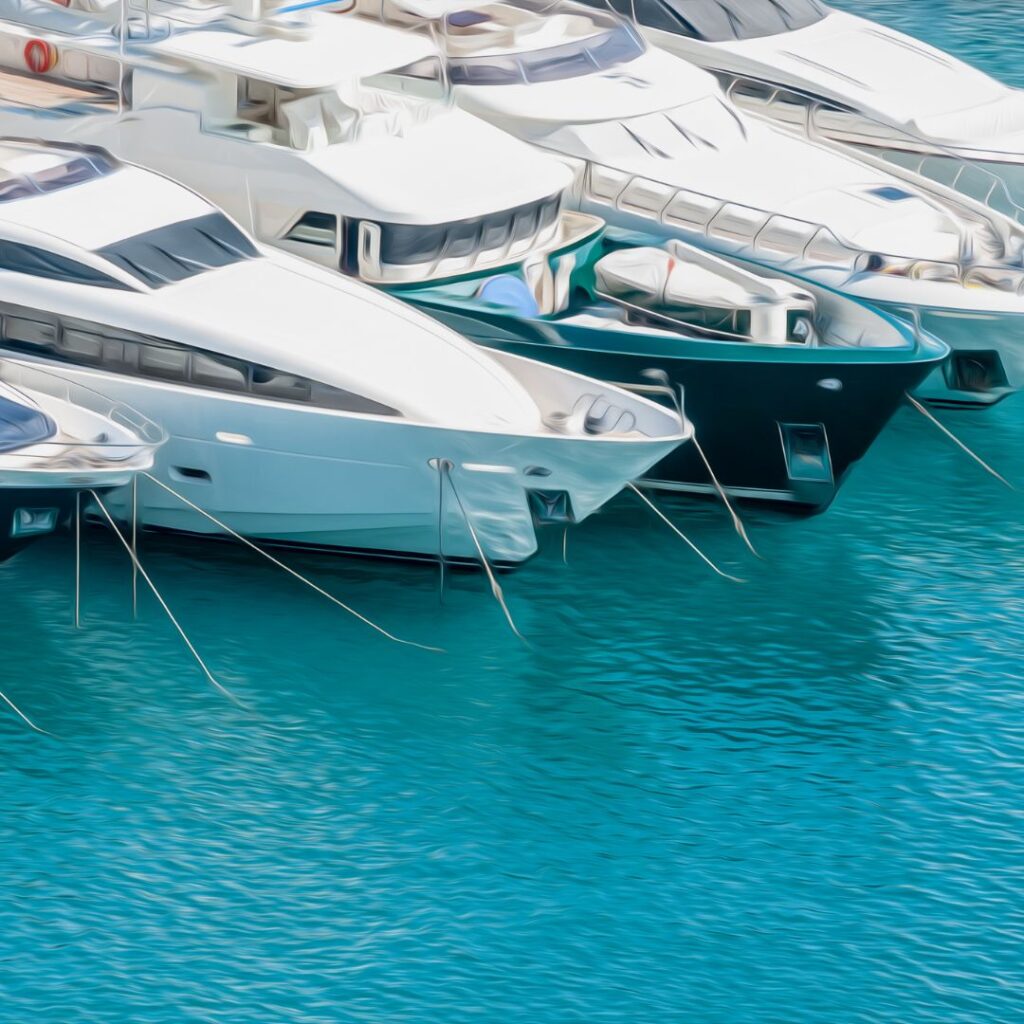 Luxury yachts docked in turquoise waters, showcasing Tess LLC's marine power management solutions for optimal performance and safety.
