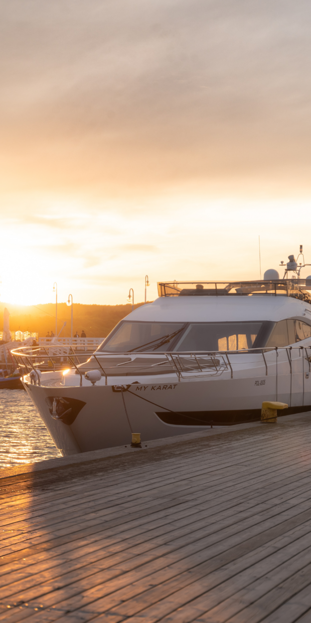 Yacht named "MY KARAT" docked at sunset, showcasing TESS Electrical LLC's yacht electrical services in Dade County.