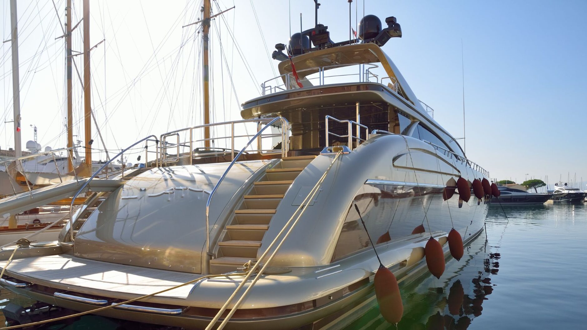 m38034 tess yacht electrical services in palm beach county hero Yacht docked in marina showcasing luxury design and features, emphasizing yacht electrical services in Palm Beach County.