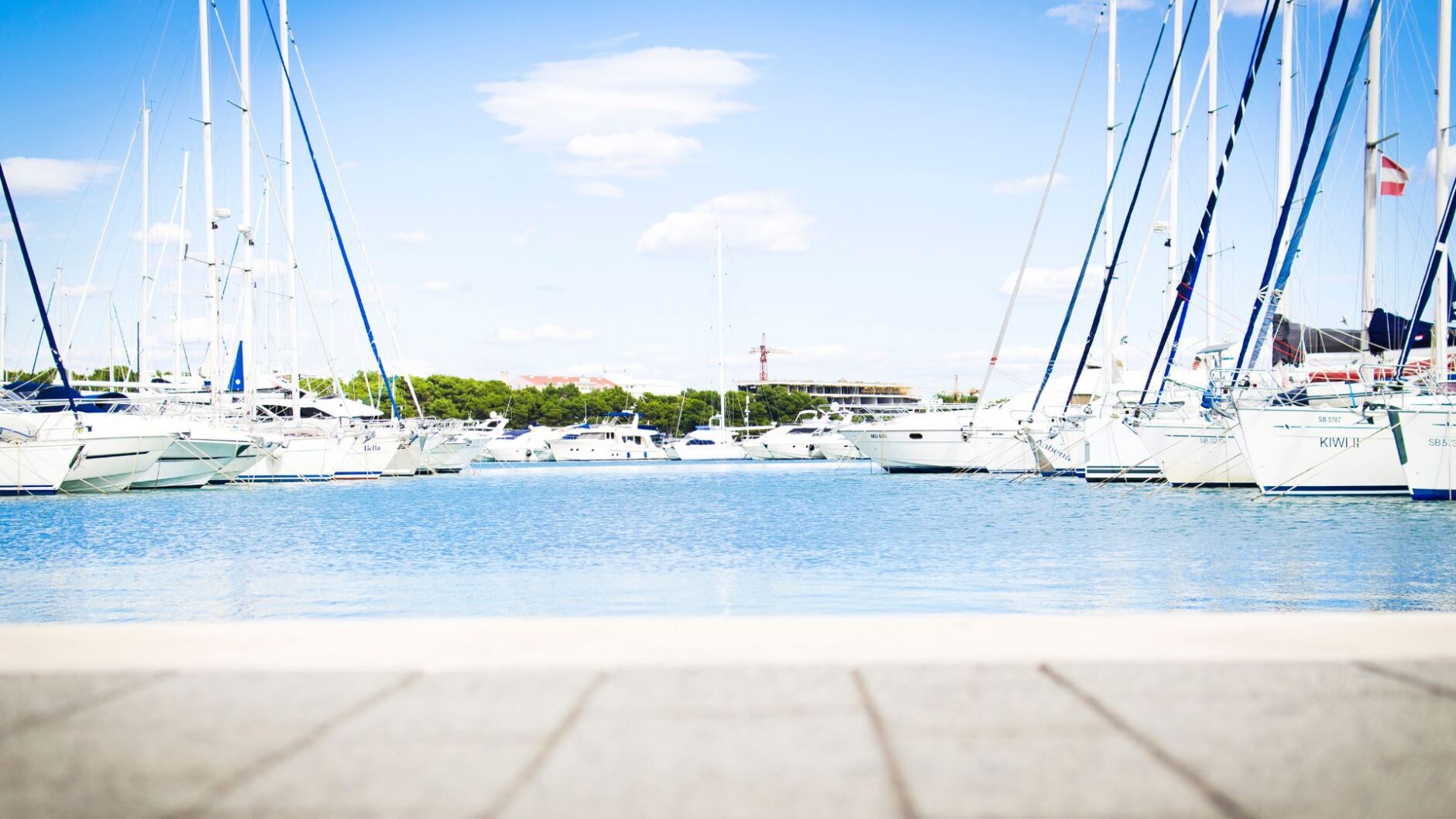 Yacht marina in Palm Beach County with several boats docked, showcasing marine electrical services environment.