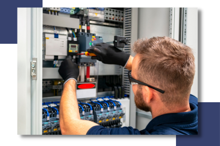 Technician adjusting electrical components in a control panel, highlighting expertise in marine electrical systems and monitoring solutions for yachts.