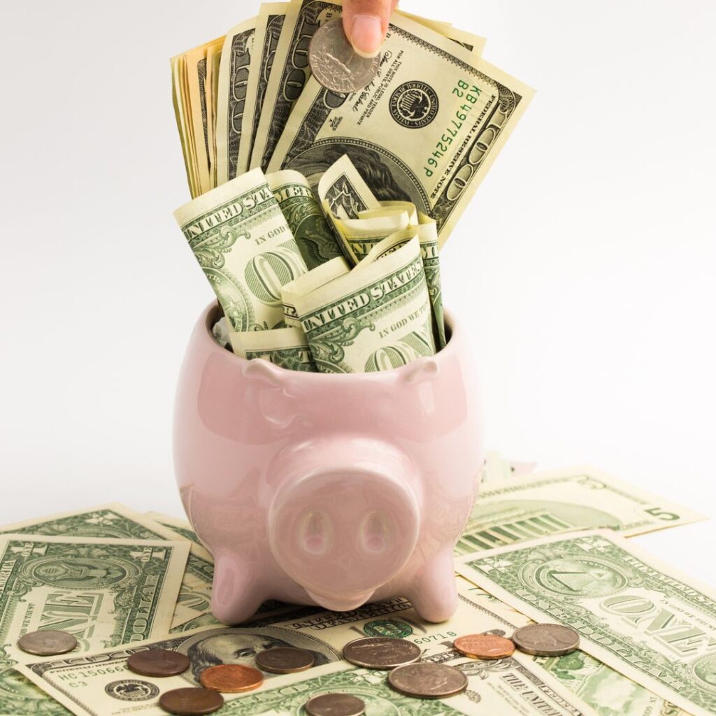 Piggy bank filled with cash and coins, symbolizing cost savings and financial efficiency in yacht power management.