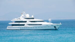 Luxurious yacht sailing on clear blue waters, symbolizing elegance and adventure, relevant to marine electrical systems and services provided by Tess Electrical LLC.