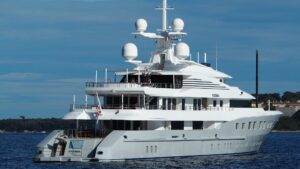 Luxury yacht navigating open waters, showcasing advanced electrical systems for marine safety and efficiency.