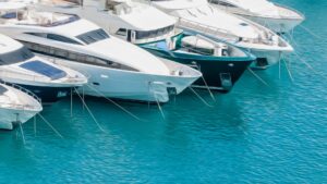 Yachts docked in clear blue waters, showcasing marine electrical systems essential for smooth sailing in Savannah, GA.