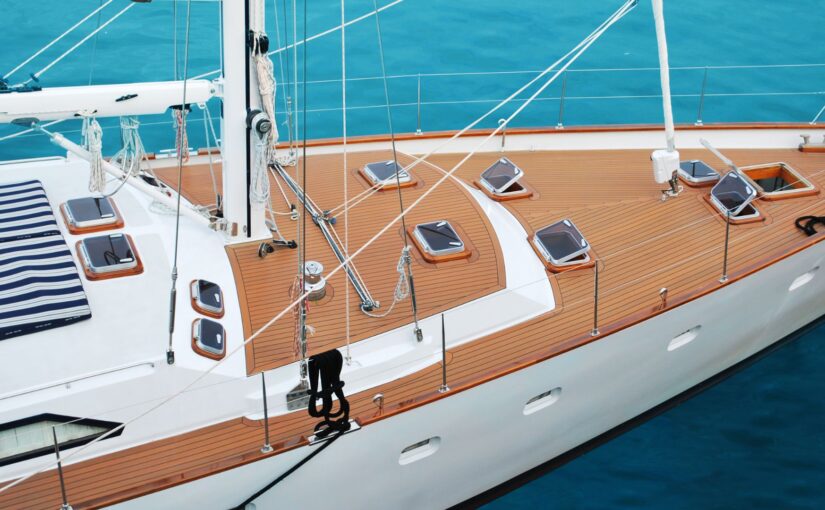 Yacht deck with wooden flooring, hatches, and ropes, highlighting the importance of marine electrical maintenance in Savannah, GA.
