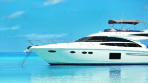 Luxury yacht anchored in calm blue waters, showcasing marine elegance and efficiency relevant to Magnus Shore Power Converters for vessel performance.