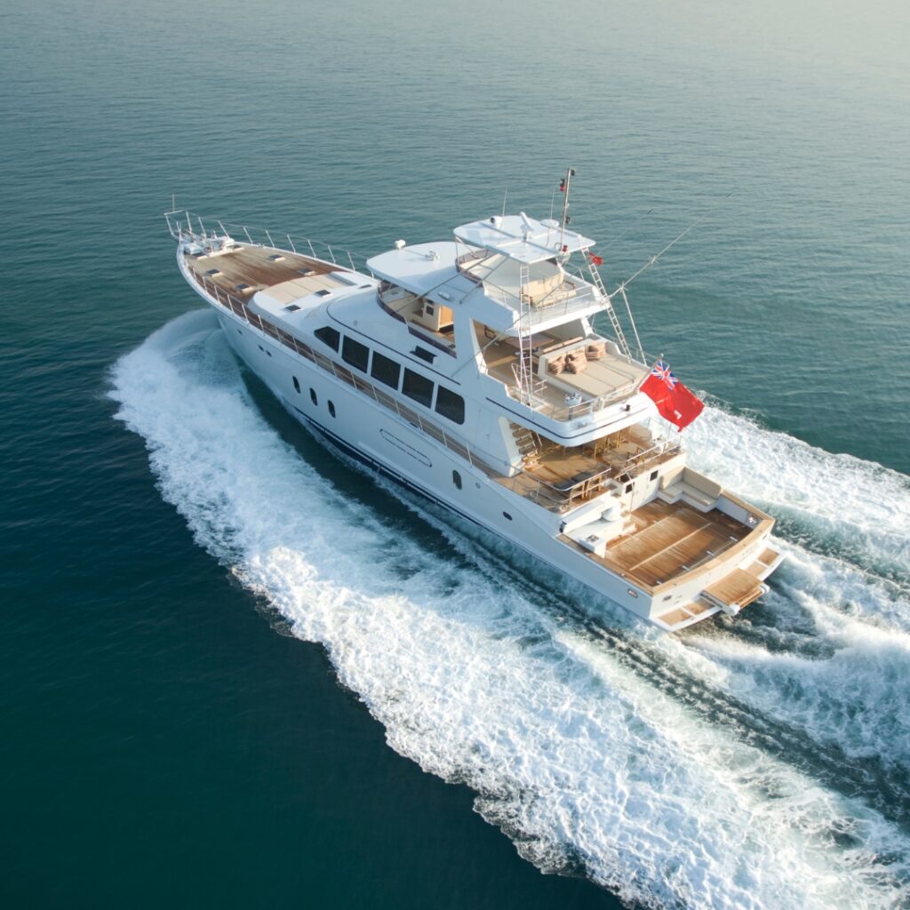 Luxury yacht navigating through calm waters, showcasing advanced marine design and efficiency, relevant to Magnus Shore Converters' impact on maritime safety and performance.