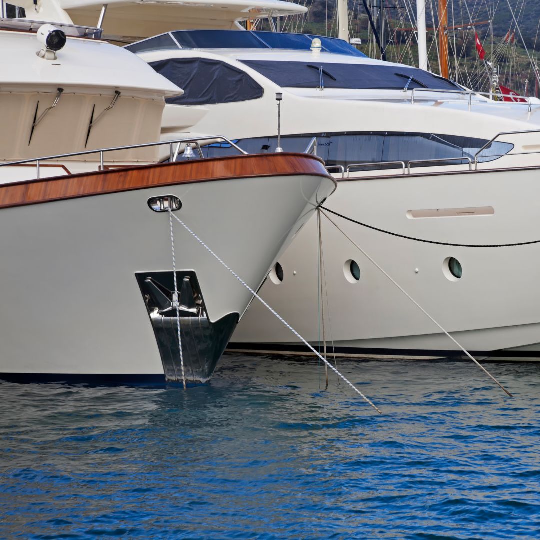 Yachts docked in tranquil waters of the Amalfi Coast, showcasing TESS, LLC's specialized marine electrical services for enhanced safety and performance.