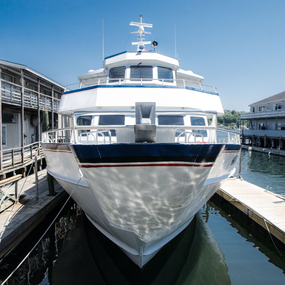 Luxury yacht docked at marina, showcasing sleek design and electrical features, reflecting Monaco's sophisticated yachting lifestyle.
