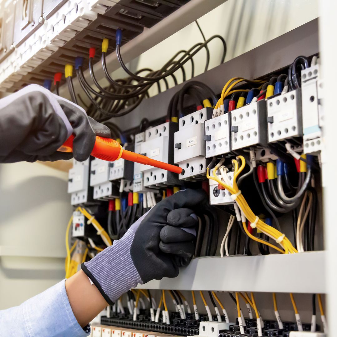 img cantalupi 02 Technician performing electrical troubleshooting and repairs on marine systems at Safe Harbor Savannah Yacht Center, focusing on wiring and circuit components.