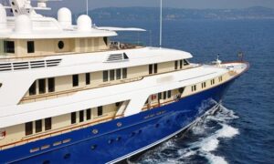 Luxury yacht navigating through water, showcasing marine engineering and electrical services relevant to TESS Electrical's offerings.