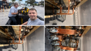 Marine electricians inspecting and working on electrical components, including copper busbars and wiring, in a yacht's power management system.